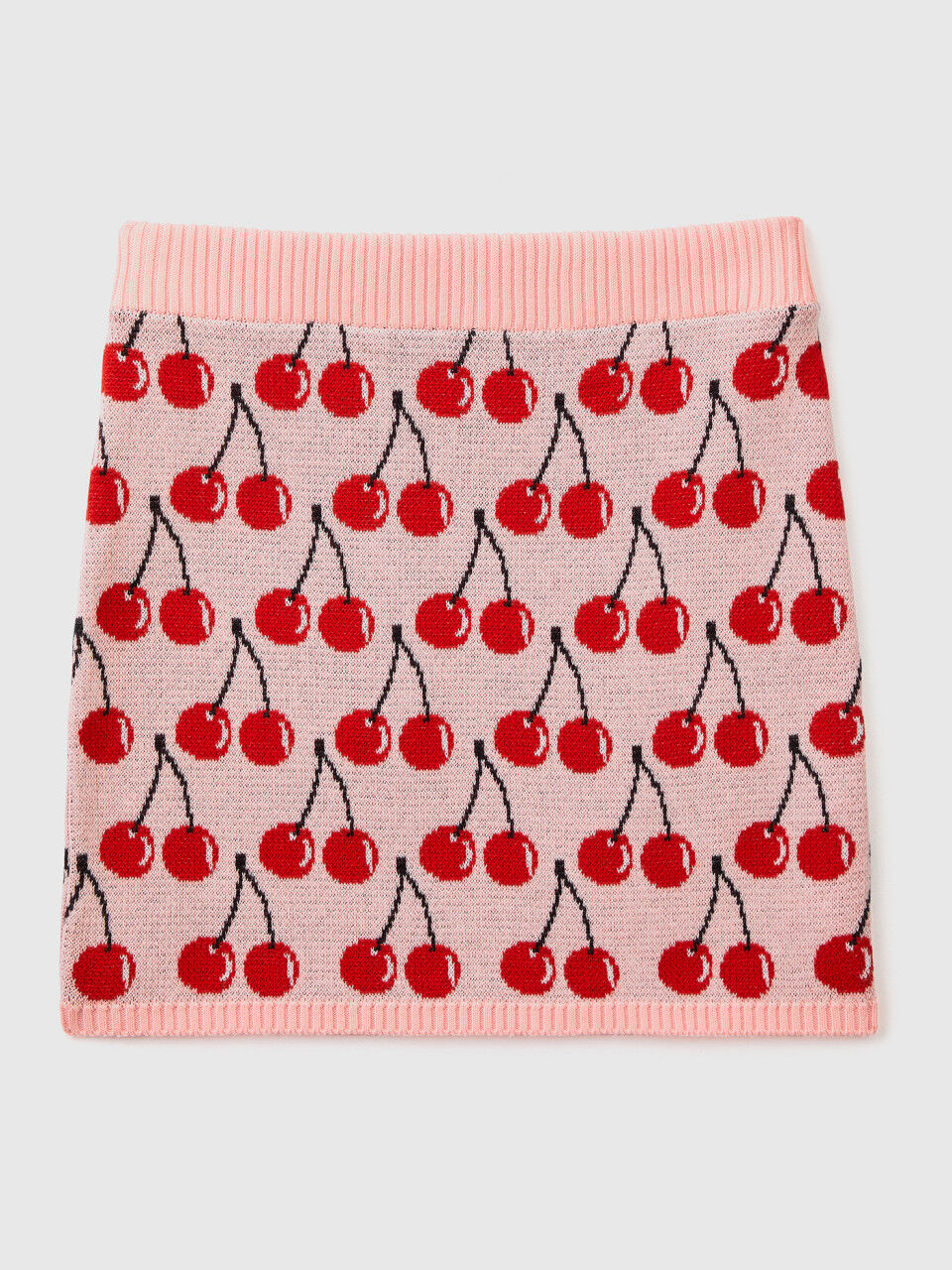 Pink mini skirt with cherry pattern